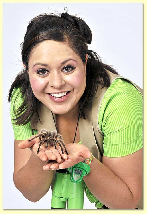 Photograph of a large, hairy tarantula in the uncovered hands of Bernadette the Bug Lady.